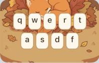 Font Pop keyboard theme preview with warm autumn leaves and cozy key colors